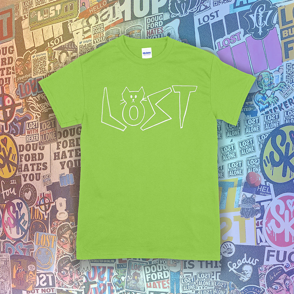 Charlottes White Cat Letters. Hand drawn design of cat shaped letters. Drawn by my daughter Charlotte, and printed with white ink on a lime green cotton shirt. Graffiti stickers in the background. 