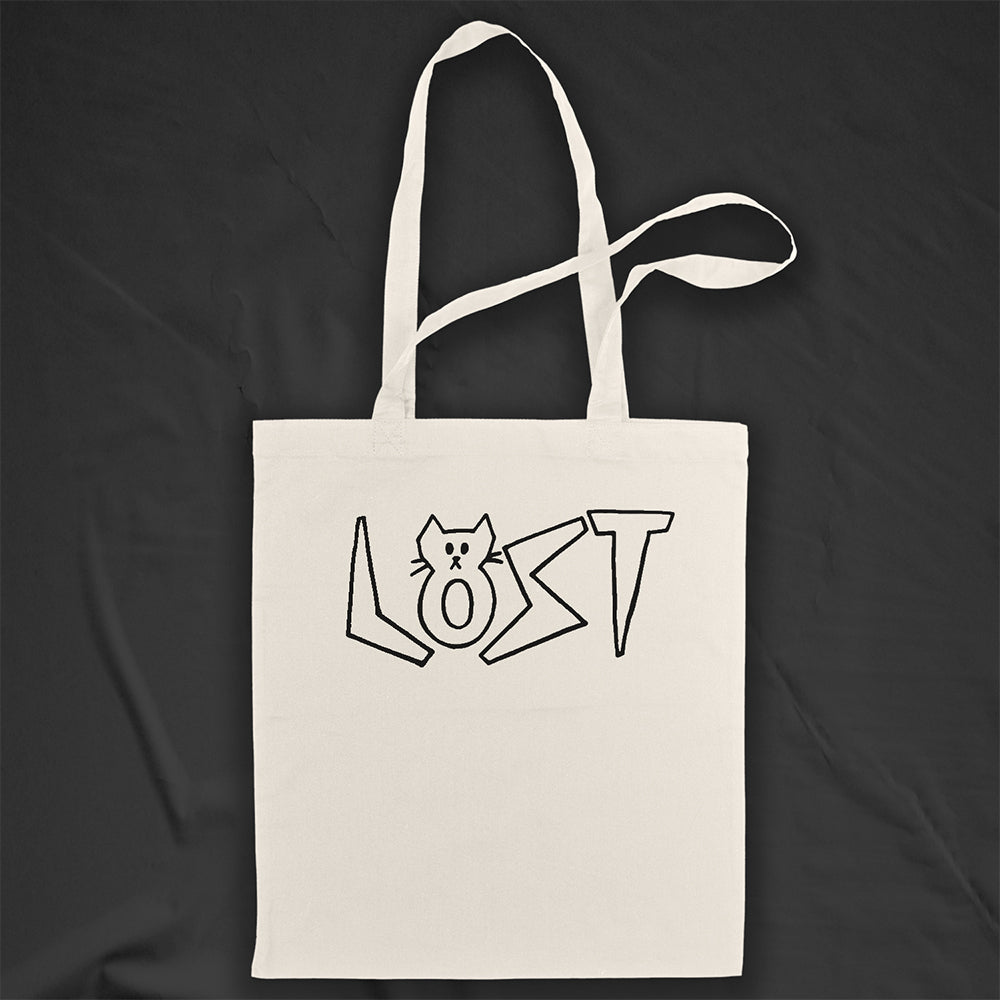 Cat shaped spell out the word LOST across a large tote bag. Hand drawn my my daughter Charlotte and printed in black on natural canvas tote bags.